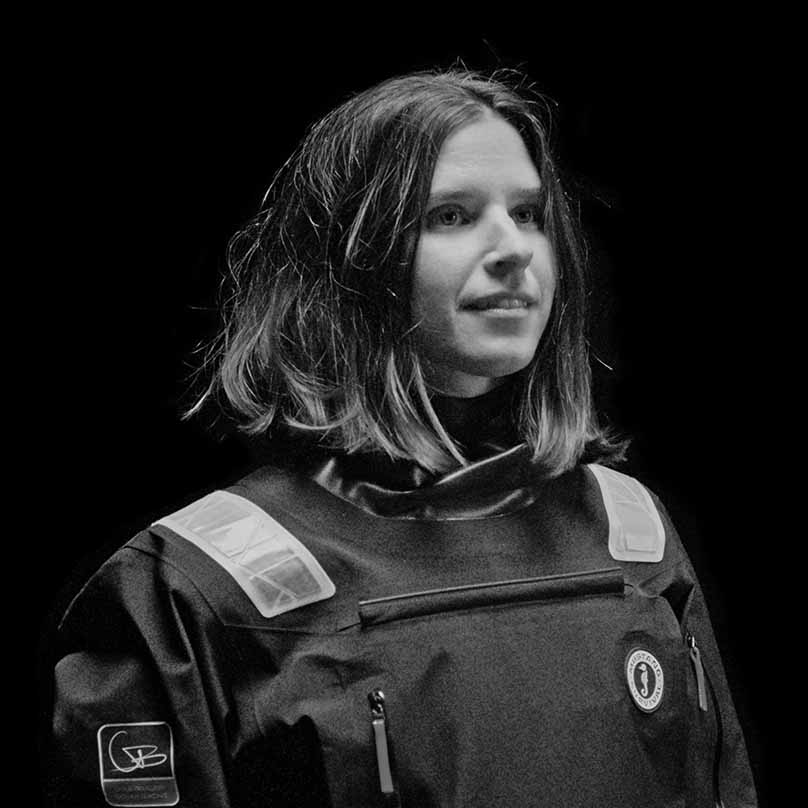 Black and white portrait of sailor Cole Brauer accompanied by a text quote praising the EP 6.5 Ocean Collection.